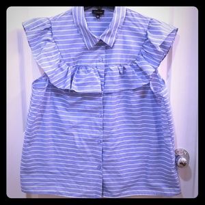 Light blue ruffled button up top.